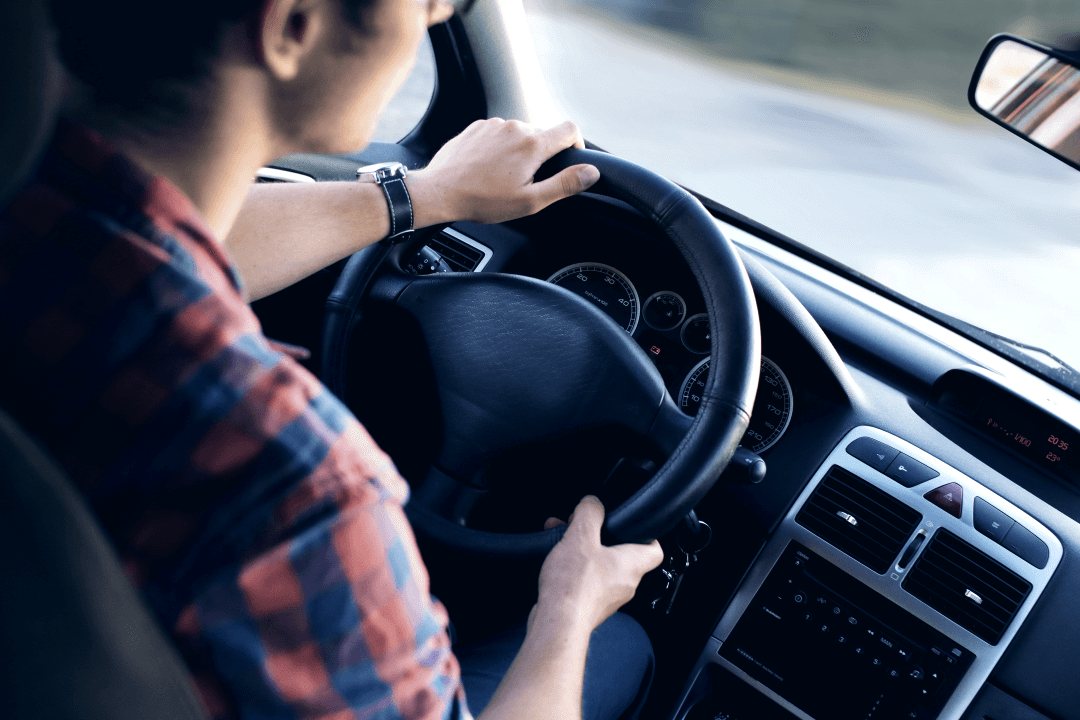 Driver at the wheel of a modern vehicle